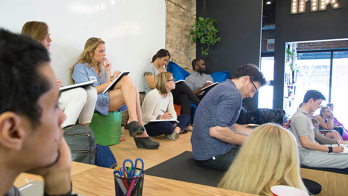 Co-op members take notes during the workshop