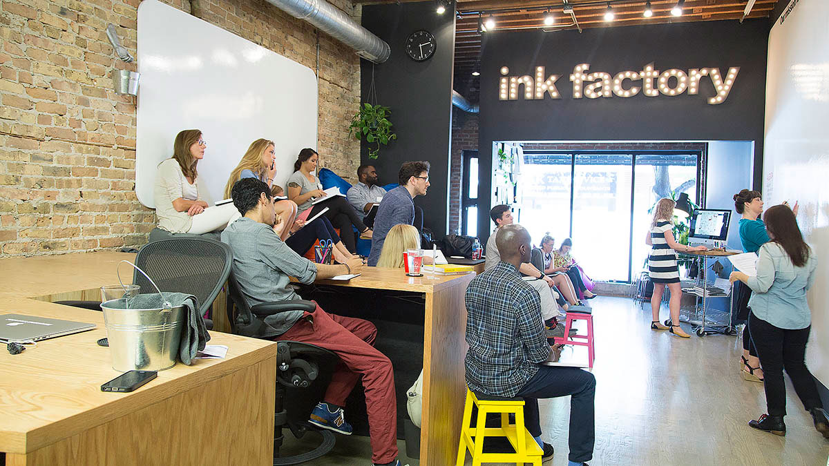 Co-op members take notes during the workshop in Ink Factory's Chicago space