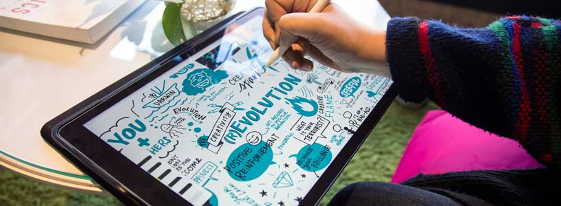 An artist creates digital visual notes on a Cintiq and visual note-taking app