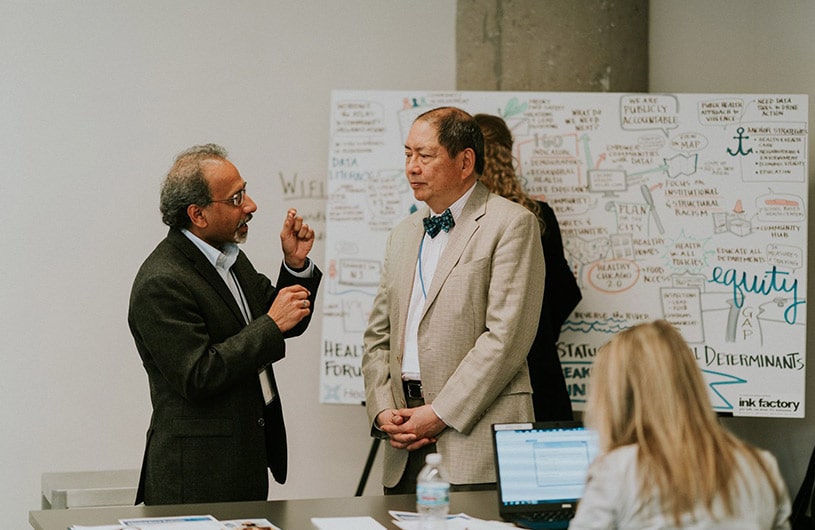 Visual note-taker is listening and graphic recording during a meeting